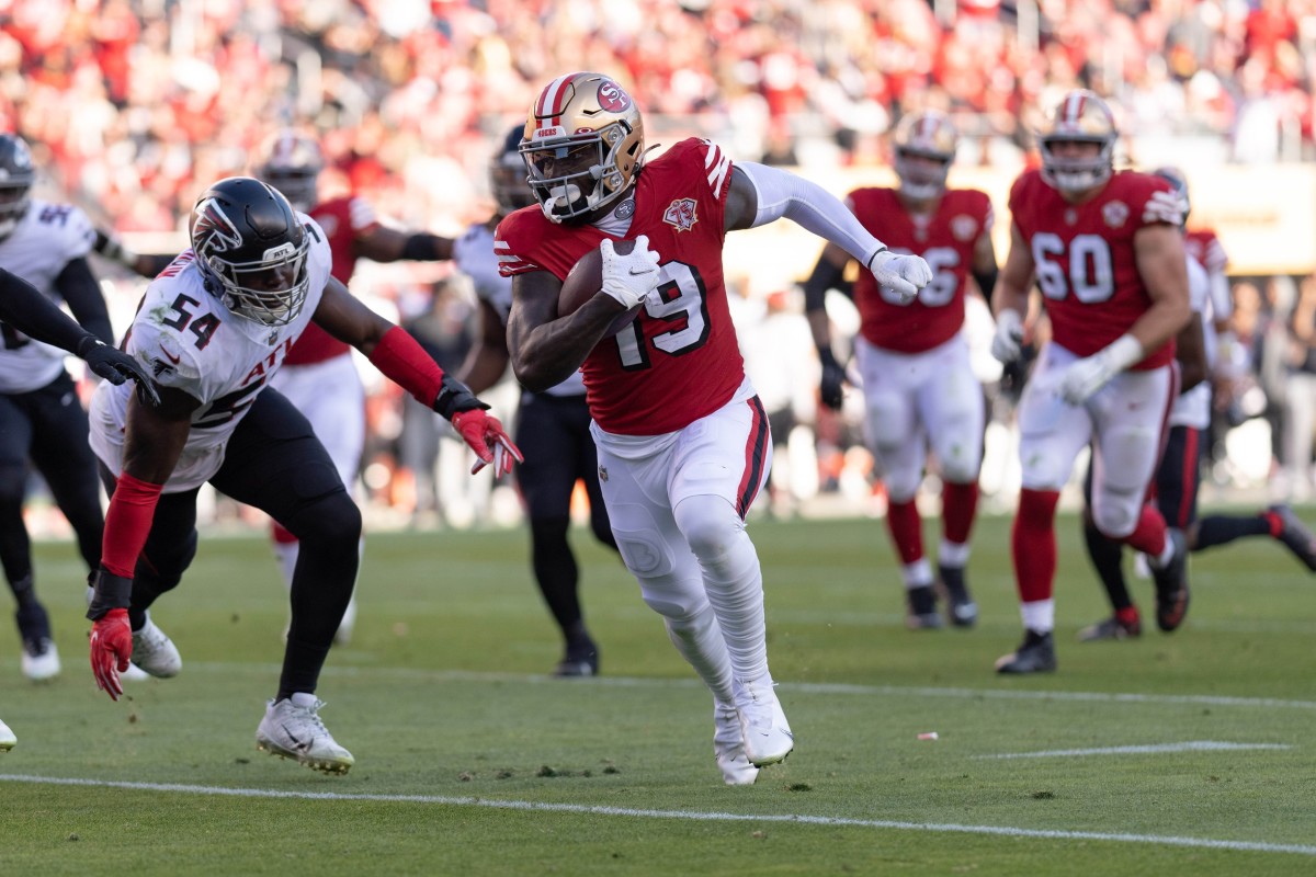San Francisco 49ers WR Deebo Samuel runs with football